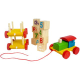 Close-up of rotating wooden alphabet and number blocks on Channapatna train toy — smooth beeswax polish, non-toxic vegetable dye paint, natural wood detail, educational toy India